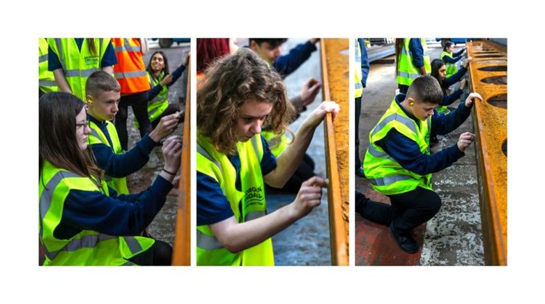 Callerton Academy students signing an exposed steel