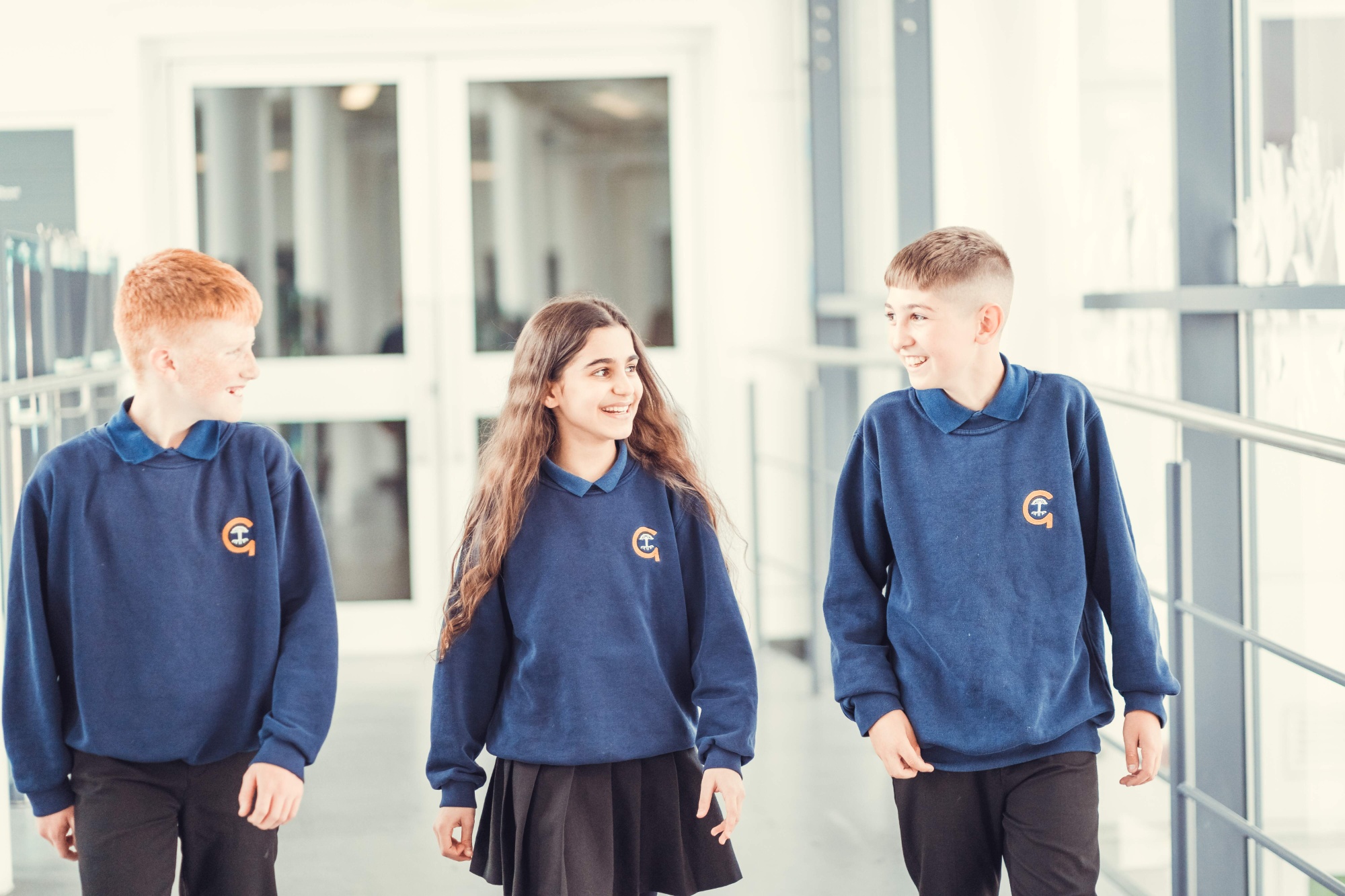 Children walking down corridor together